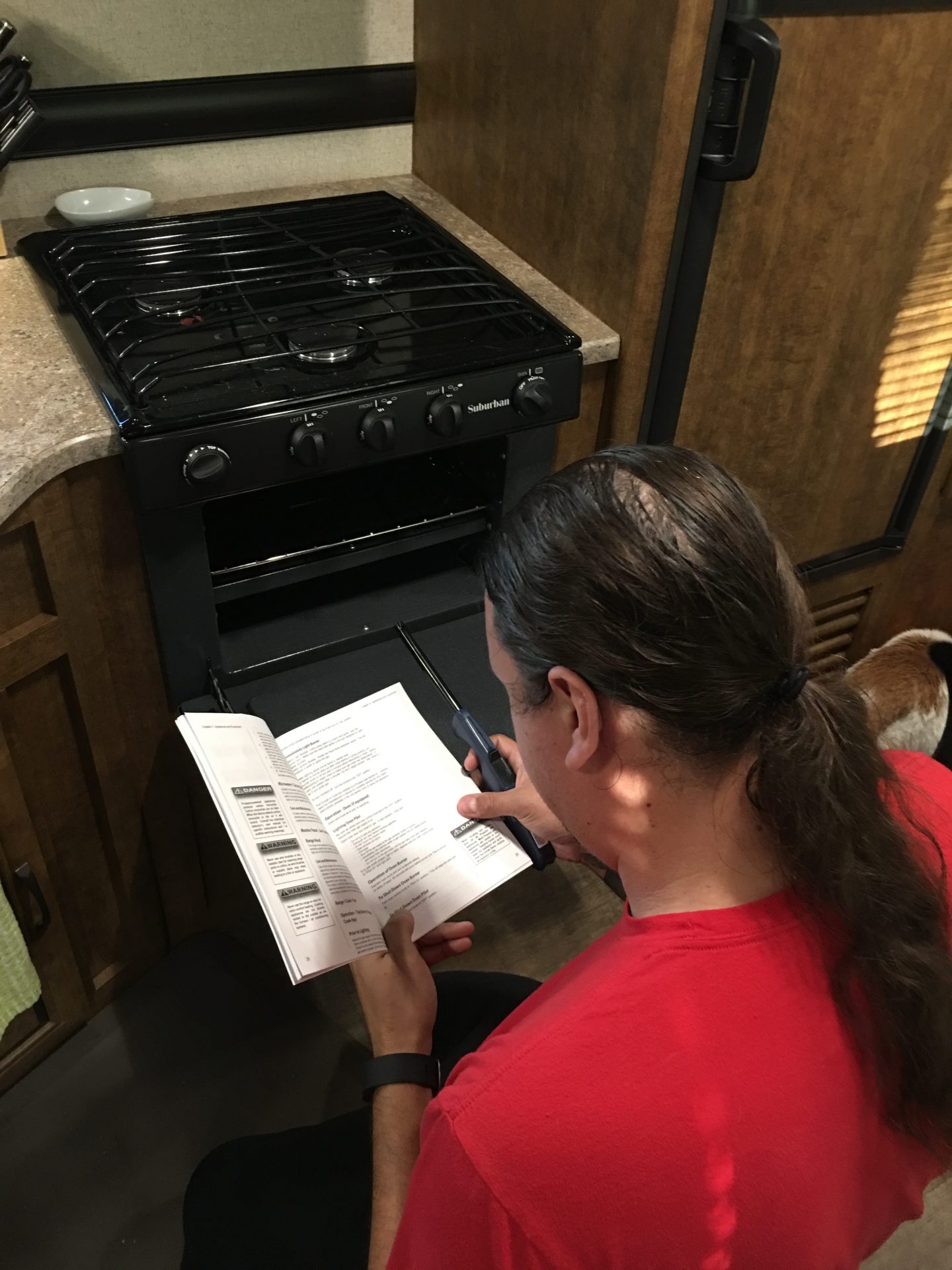 Aaron trying to figure out the oven