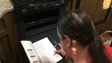 Aaron trying to figure out the oven